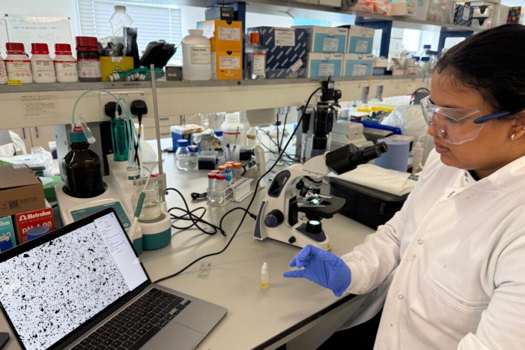 Woman in a lab with lab clohing