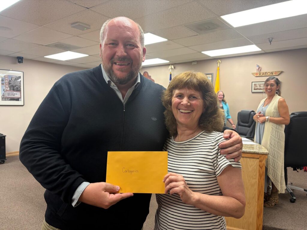 Ed receiving license from Synthia Molina